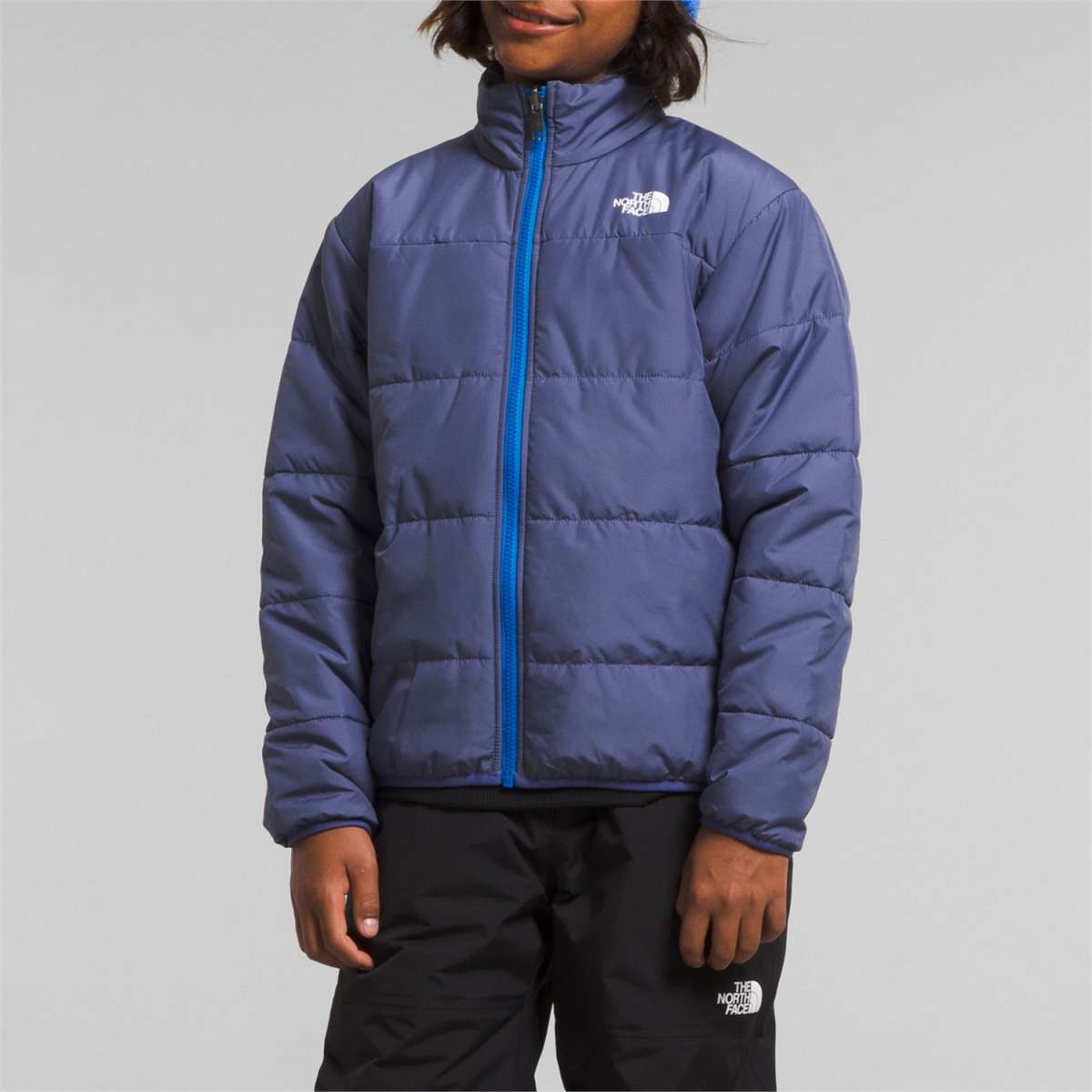 North Face Boys Freedom Triclimate Jacket 2024 - A blue and white jacket with a logo on the left chest.
