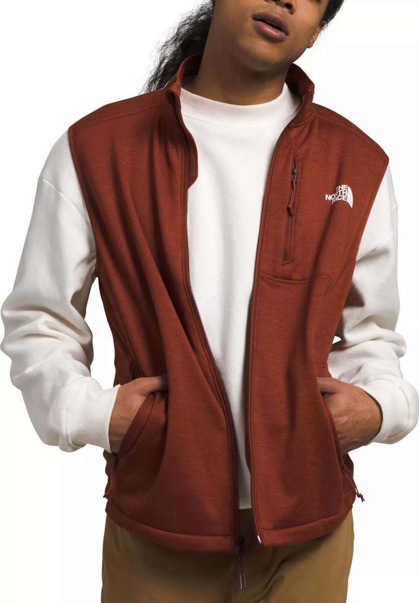 North Face Canyonlands Full Zip Vest 2024 - A brown vest with a zippered front and two side pockets, worn by a model over a white shirt.