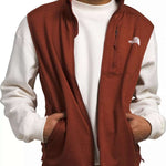 North Face Canyonlands Full Zip Vest 2024 - A brown vest with a zippered front and two side pockets, worn by a model over a white shirt.