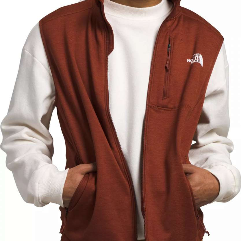 North Face Canyonlands Full Zip Vest 2024 - A brown vest with a zippered front and two side pockets, worn by a model over a white shirt.