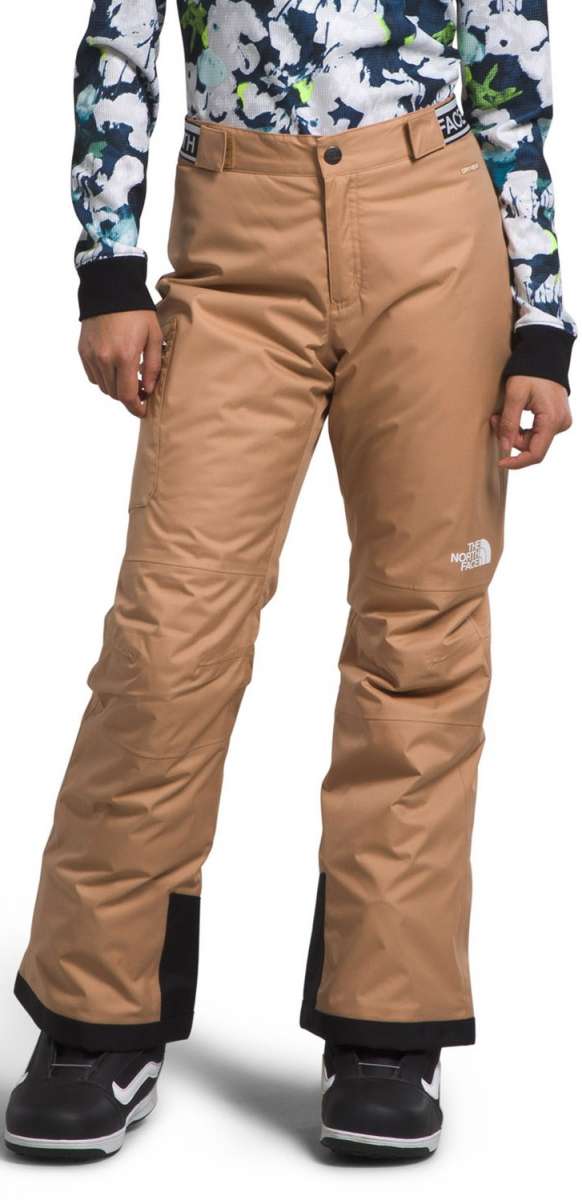 North Face Girls Freedom Insulated Pant 2024 - A pair of tan snow pants with a white logo on the left leg and black trim around the cuffs.