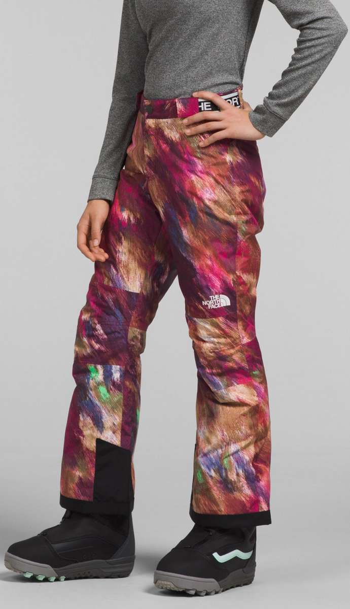 North Face Girls Freedom Insulated Pant 2024 - A pair of insulated ski pants with a colorful abstract pattern in shades of pink, purple, and brown.