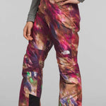 North Face Girls Freedom Insulated Pant 2024 - A pair of insulated ski pants with a colorful abstract pattern in shades of pink, purple, and brown.