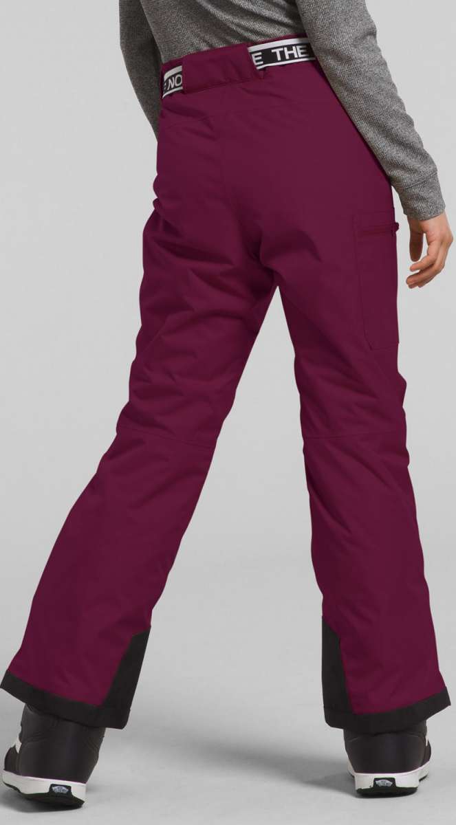 North Face Girls Freedom Insulated Pant 2024 - A pair of dark-colored snow pants with a white logo on the waistband and black accents at the bottom.