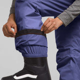 North Face Girls Freedom Insulated Pant 2024 - A pair of purple snow pants with a black waistband and elastic cuffs at the ankles.