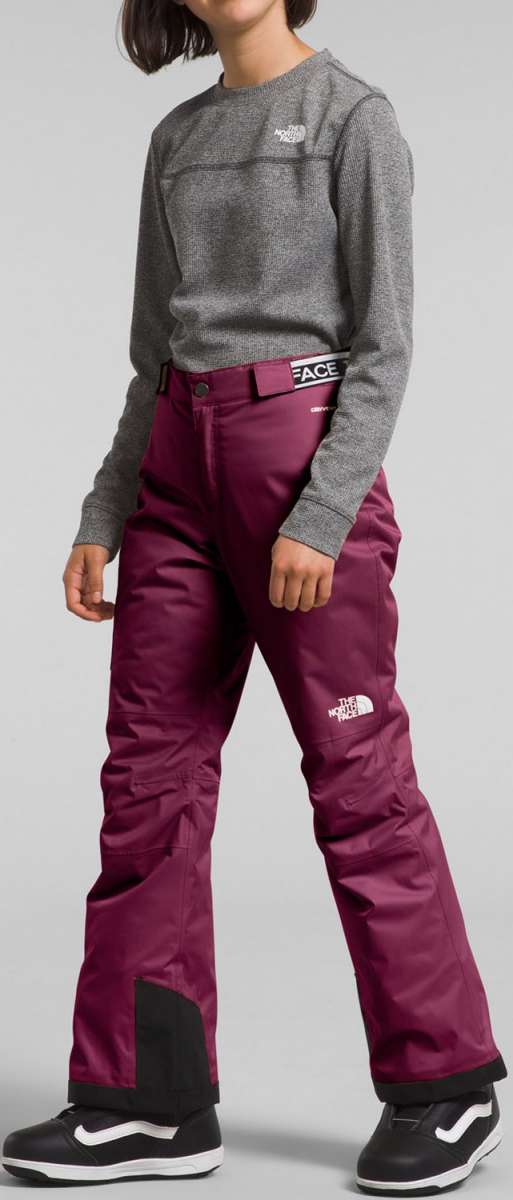 North Face Girls Freedom Insulated Pant - A pair of insulated ski pants with a white logo on the left thigh and a black zipper pull on the right side.