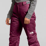 North Face Girls Freedom Insulated Pant - A pair of insulated ski pants with a white logo on the left thigh and a black zipper pull on the right side.