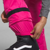 North Face Girls Freedom Insulated Pant 2024 - A pair of bright pink snow pants with black trim and a black elastic waistband.