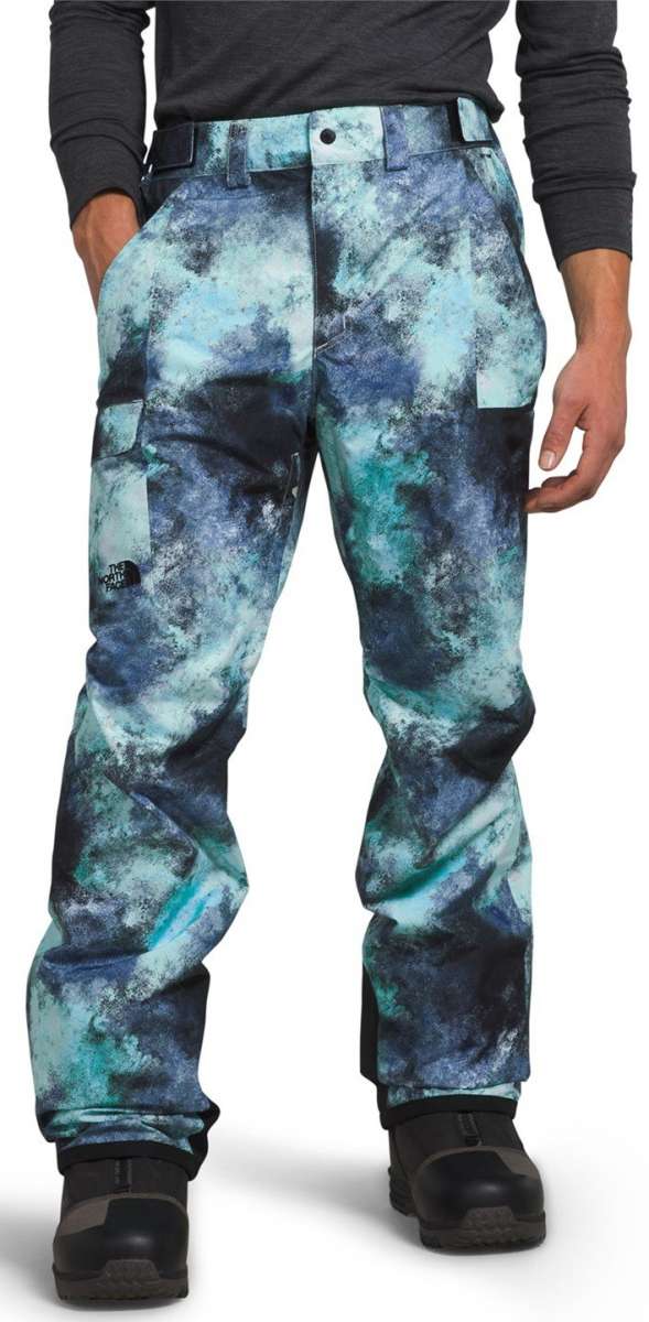 North Face Freedom Stretch Pants 2024 - A pair of blue snow pants with a black pattern and white accents, featuring a belt loop on the waistband.