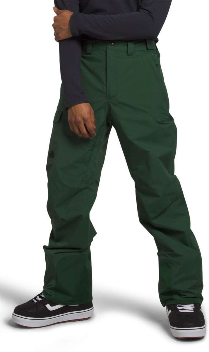 North Face Freedom Stretch Pants 2024 - Dark green pants with a subtle black logo on the left thigh and two zippered pockets on the right side.