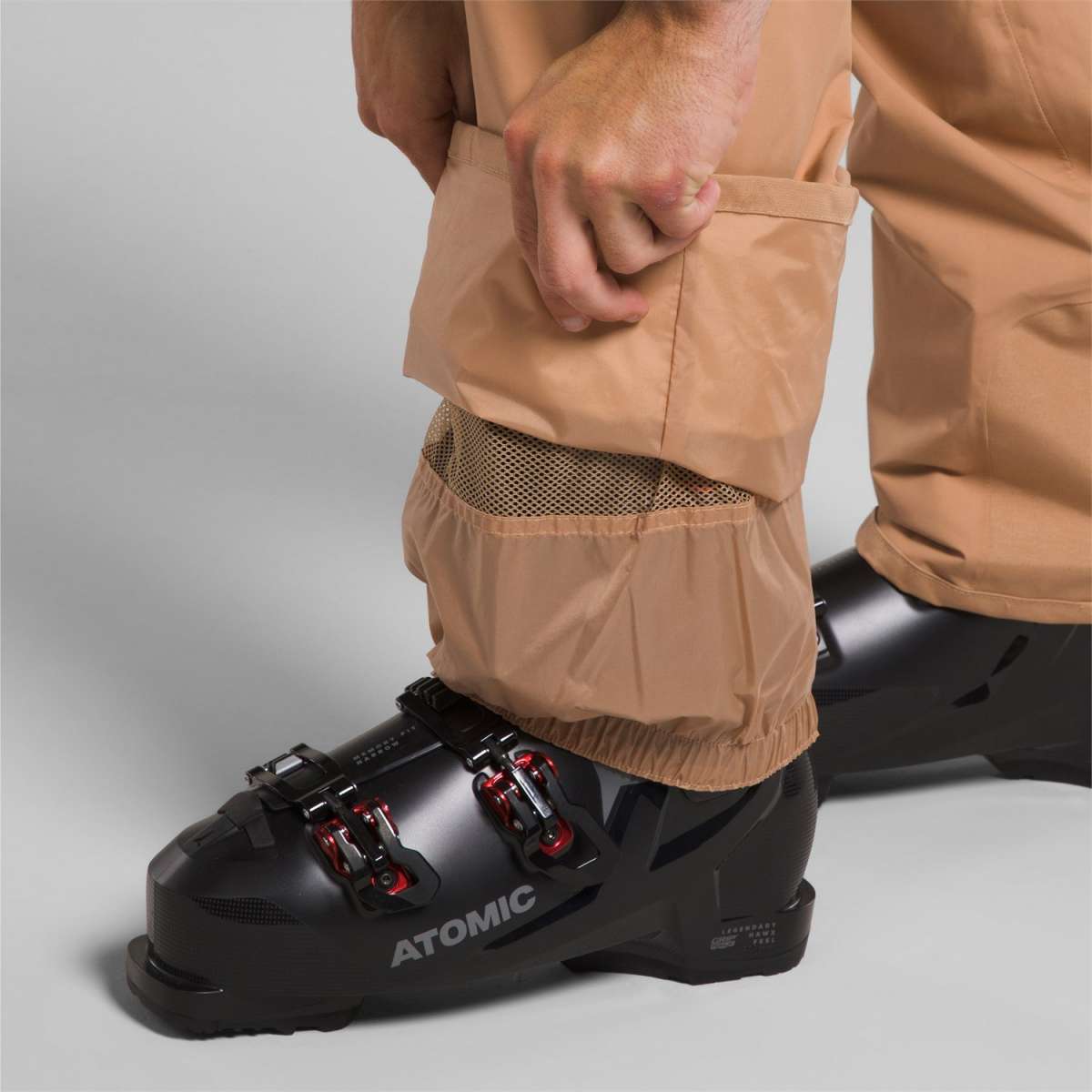 North Face Freedom Stretch Pants 2024 - A pair of tan-colored pants with a mesh pocket on the side.