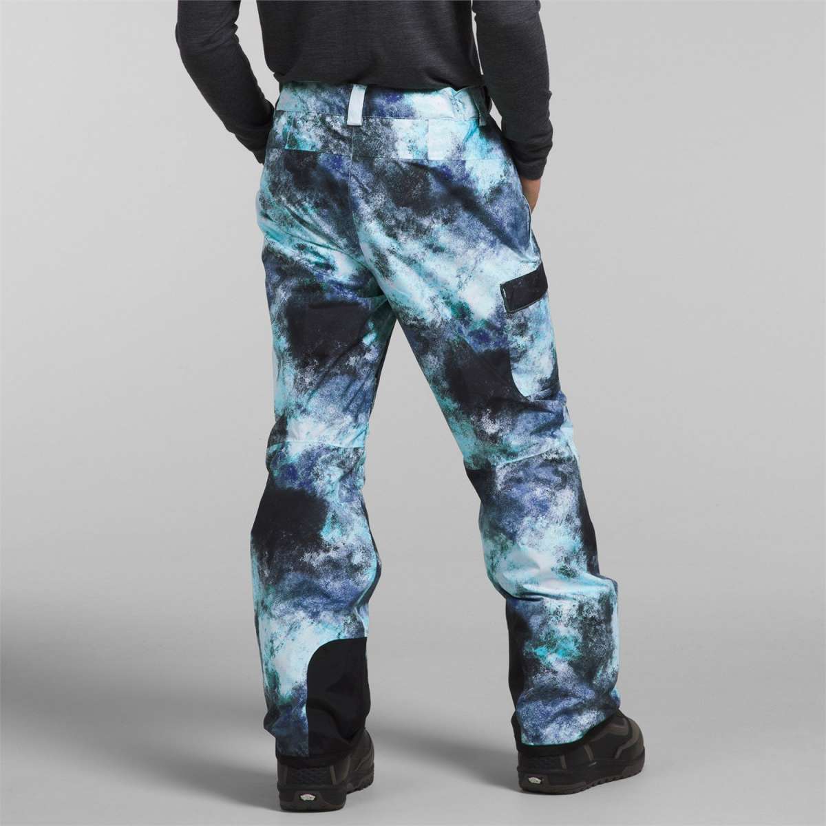 North Face Freedom Stretch Pants 2024 - A pair of black snow pants with a subtle white pattern and a small logo on the left leg.