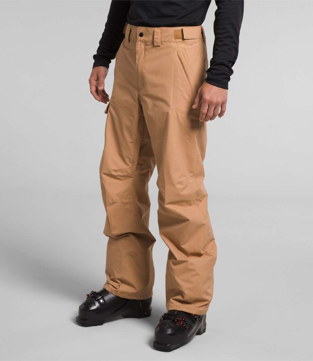 North Face Freedom Stretch Pants 2024 - Black pants with a subtle white stripe down the side and zippered pockets.