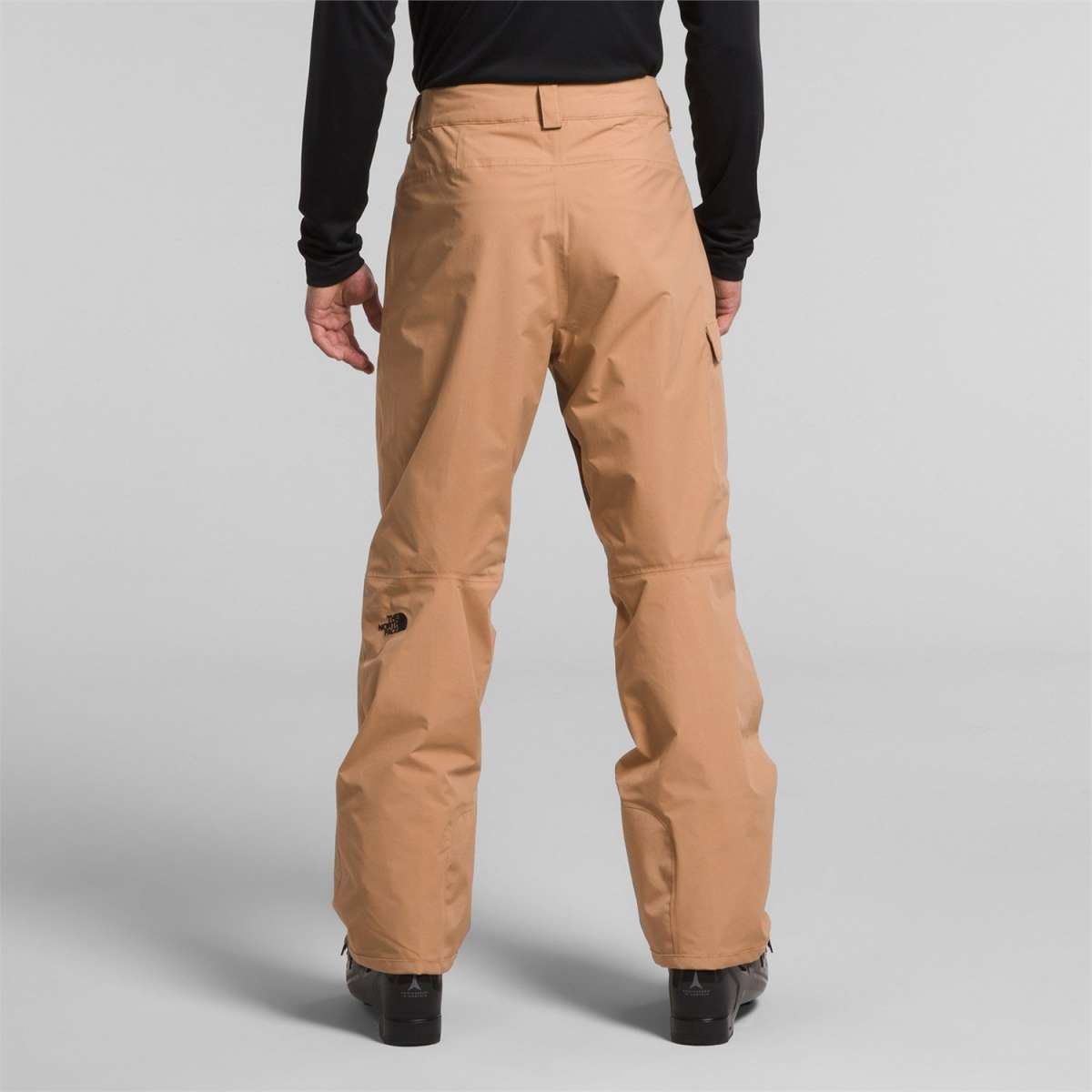 North Face Freedom Stretch Pants - Black pants with a subtle white logo on the left thigh and black drawstring at waistband.