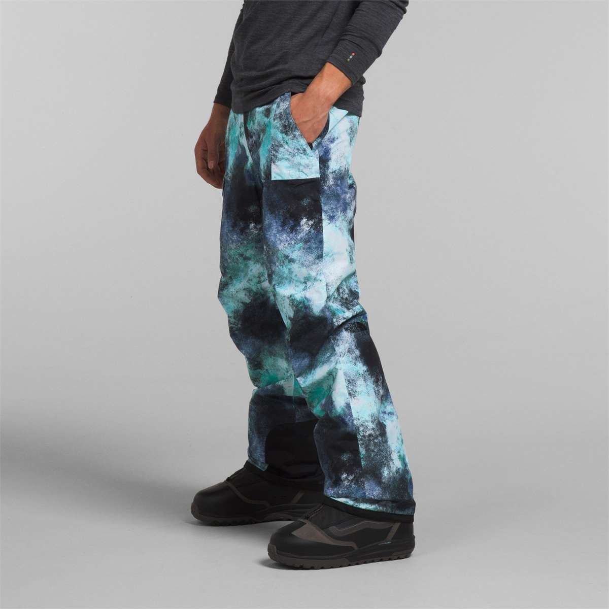 North Face Freedom Stretch Pants 2024 - A pair of black snow pants with a subtle white pattern and a zippered pocket on the thigh.