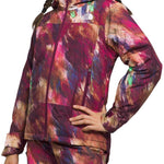 North Face Girls Freedom Insulated Jacket - A young girl with long brown hair in braids is wearing a purple jacket with a colorful abstract pattern of pink, blue, and tan brush strokes.