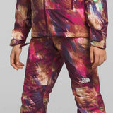 North Face Girls Freedom Insulated Jacket 2024 - A multicolored jacket with a hood, featuring a white logo on the chest and a zipper down the front.