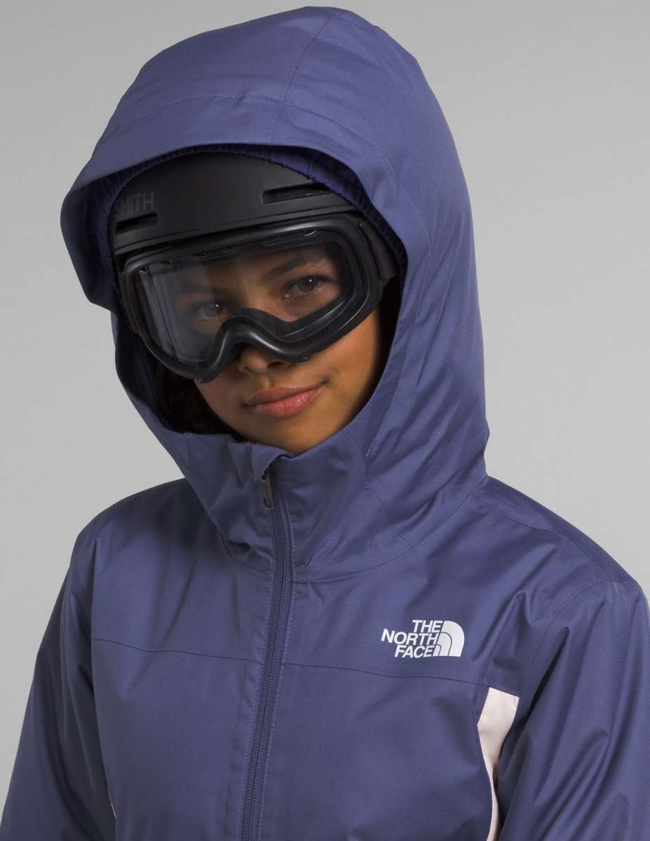 North Face Girls Freedom Insulated Jacket 2024 - A dark blue jacket with a white logo on the left chest and a zipper down the front.
