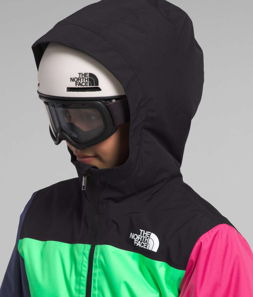 North Face Girls Freedom Insulated Jacket 2024 - A black, green, and pink jacket with a white logo on the chest.