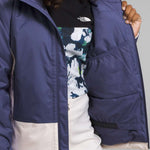 North Face Girls Freedom Insulated Jacket - A dark blue jacket with a white logo on the chest and a zipper closure.