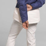 North Face Girls Freedom Insulated Jacket 2024 - A dark blue jacket with a hood and white trim on the pockets.
