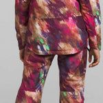 North Face Girls Freedom Insulated Jacket 2024 - A multicolored jacket with a hood, featuring a pink and purple abstract pattern on a light brown background.