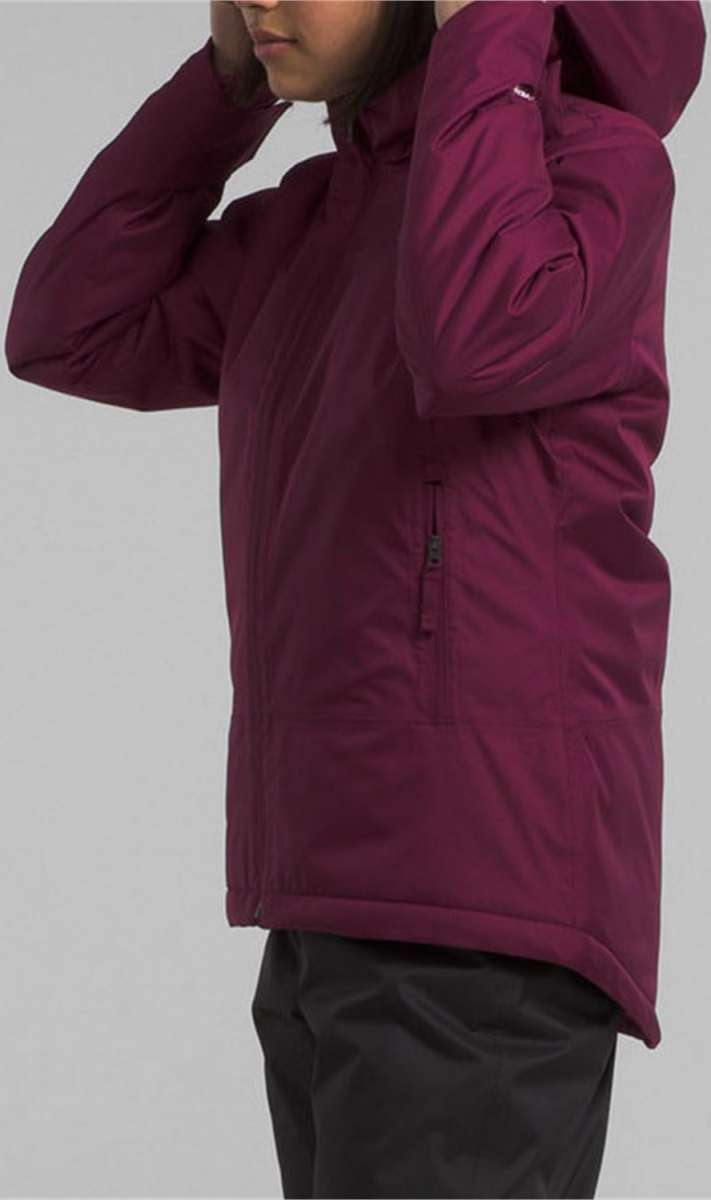 North Face Girls Freedom Insulated Jacket 2024 - A dark-colored, insulated jacket with a hood and zipper closure.