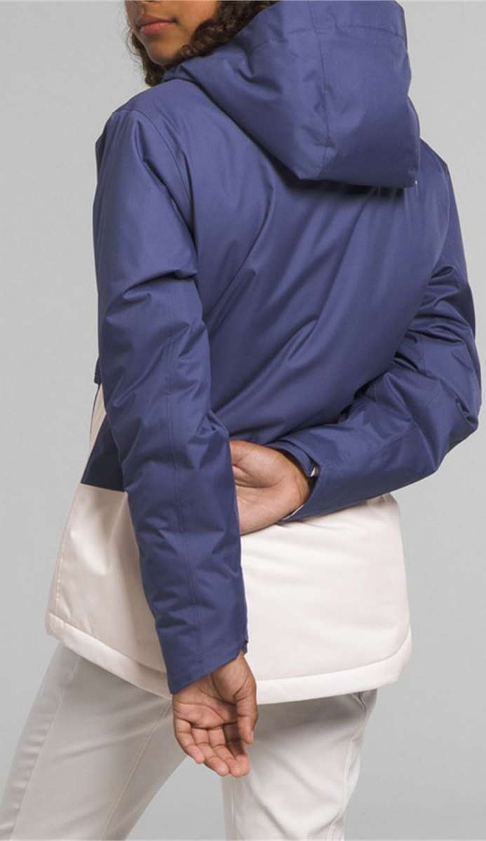 North Face Girls Freedom Insulated Jacket 2024 - A blue and white insulated jacket with a hood, worn by a model from behind.