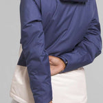 North Face Girls Freedom Insulated Jacket 2024 - A blue and white insulated jacket with a hood, worn by a model from behind.
