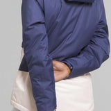 North Face Girls Freedom Insulated Jacket 2024 - A blue and white insulated jacket with a hood, worn by a model from behind.