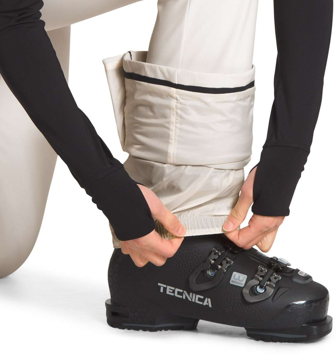 North Face Ladies Amy Softshell Pant - A pair of tan-colored pants with a black stripe at the waistband, worn by a model from behind.