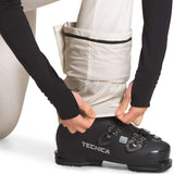 North Face Ladies Amy Softshell Pant - A pair of tan-colored pants with a black stripe at the waistband, worn by a model from behind.