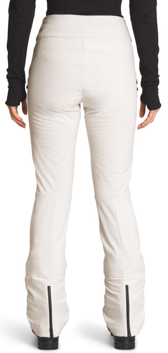 North Face Ladies Amy Softshell Pant - A pair of white pants with a subtle black stripe on the side, featuring a zippered pocket at the back.