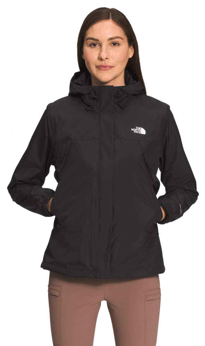 North Face Ladies Antora Triclimate Shell Jacket 2024 - A black jacket with a white logo on the left chest and two zippered pockets on either side of the waist.