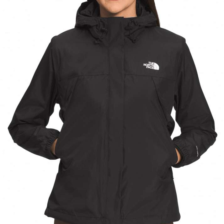 North Face Ladies Antora Triclimate Shell Jacket 2024 - A black jacket with a white logo on the left chest and two zippered pockets on either side of the waist.