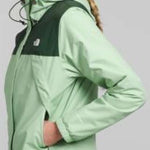 North Face Ladies Antora Triclimate Shell Jacket - A light green jacket with a darker green panel on the chest and shoulder area, featuring a hood and zipper closure.