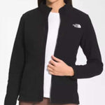 North Face Ladies Antora Triclimate Shell Jacket - A black jacket with a white logo on the left chest and a zipper down the front.