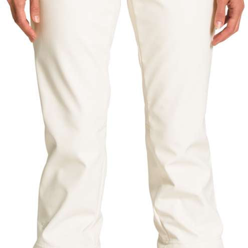 North Face Ladies Apex Stretch Soft-Shell Pants Short - These pants are a light beige color with a subtle sheen, featuring two black buttons on the waistband and a zippered pocket on one side.