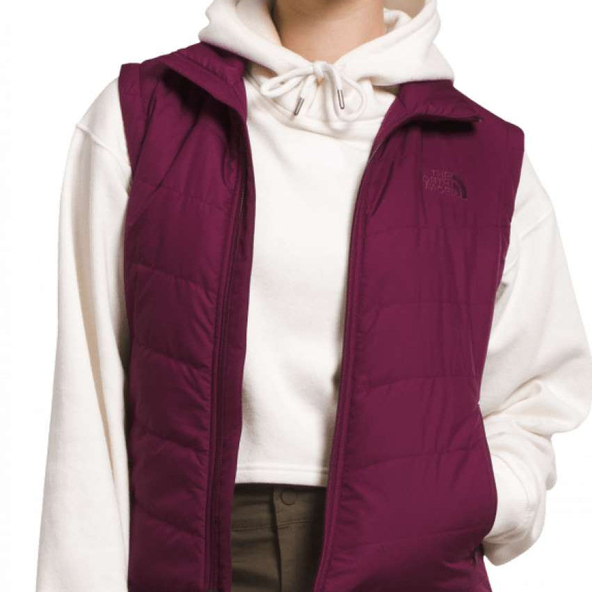 North Face Ladies Tamburello Insulated Vest 2024 - A dark-colored, quilted vest with a zip closure and two side pockets.