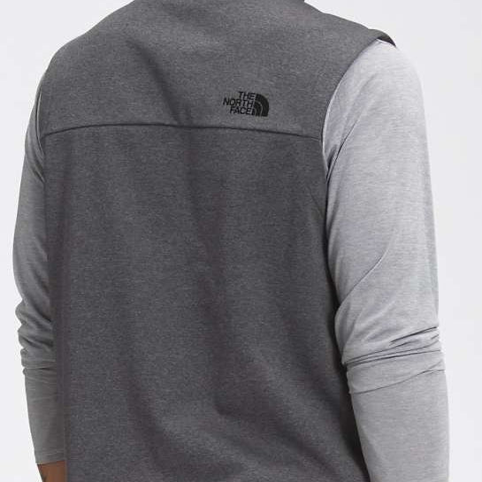 North Face Apex Canyonwall Vest - A dark gray fleece vest with a black logo on the upper left side of the back.