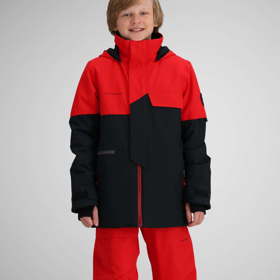 Obermeyer Juniors Axel Insulated Jacket 2024 - A red and black insulated jacket with a high collar, zippered pockets, and a snow skirt.