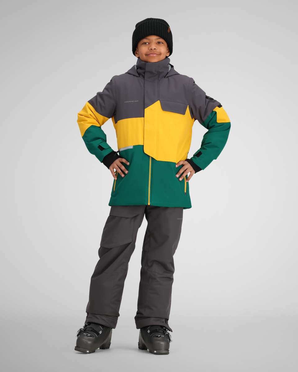 Obermeyer Juniors Axel Insulated Jacket 2024 - A dark green and yellow jacket with a gray chest pocket, worn by a model posing with hands on hips.