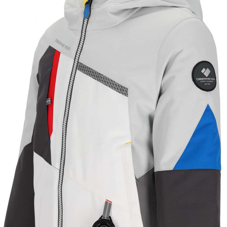 Obermeyer Juniors Orb Insulated Jacket 2024 - A white jacket with a red zipper and gray accents on the chest.