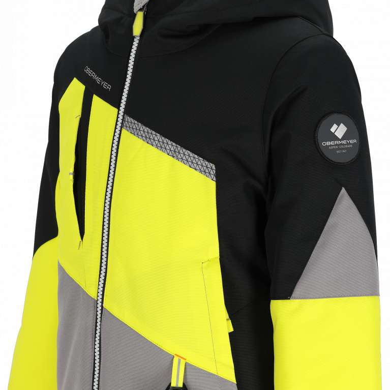 Obermeyer Juniors Orb Insulated Jacket 2024 - A black, grey and yellow jacket with a zipper down the front.