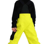 Obermeyer Juniors Volt Insulated Pant 2024 - Bright yellow insulated ski pants with black accents on the side and back pockets.