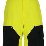 Obermeyer Juniors Volt Insulated Pant 2024 - Bright yellow insulated ski pants with black accents on pockets and straps.
