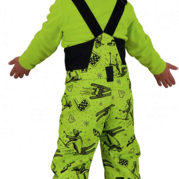 Obermeyer Juniors Warp Insulated Bib Pants 2022 - A pair of lime green snow pants with a ski-themed pattern, featuring skiers and snowboards in black.