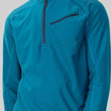 Obermeyer Flex 1/4 Zip T-Neck 2023 - A teal blue zip-up sweater with a high collar and two chest pockets, worn by a model on the left side of the image.