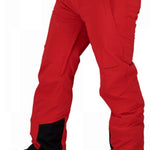 Obermeyer Force Insulated Pants Short 2022 - A pair of red insulated pants with black accents on the side pockets and a black logo patch near the right hip.