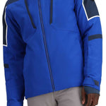 Obermeyer Foundation Insulated Jacket Tall 2024 - A blue jacket with a hood, featuring white trim and black accents on the shoulders and chest.